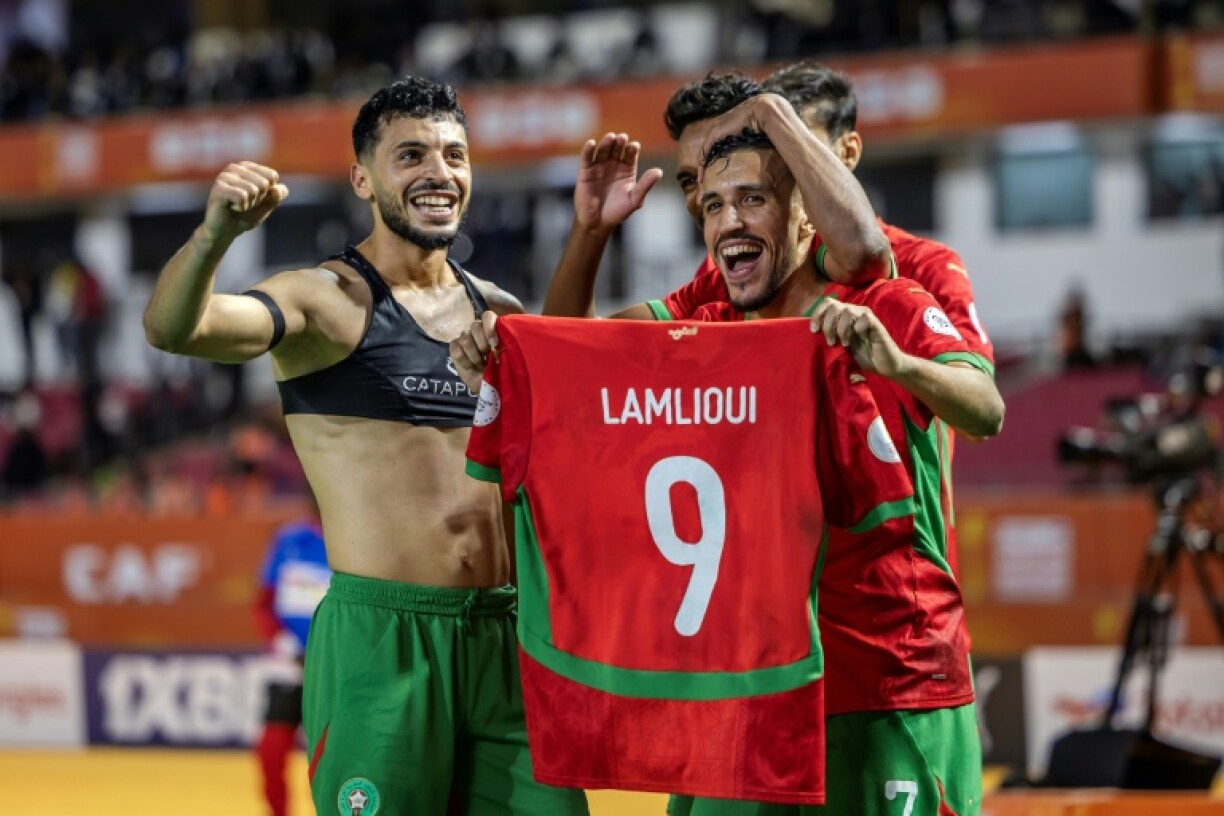 Morocco's Oussama Lamlioui (L) scored the winning goal with 10 minutes remaining
