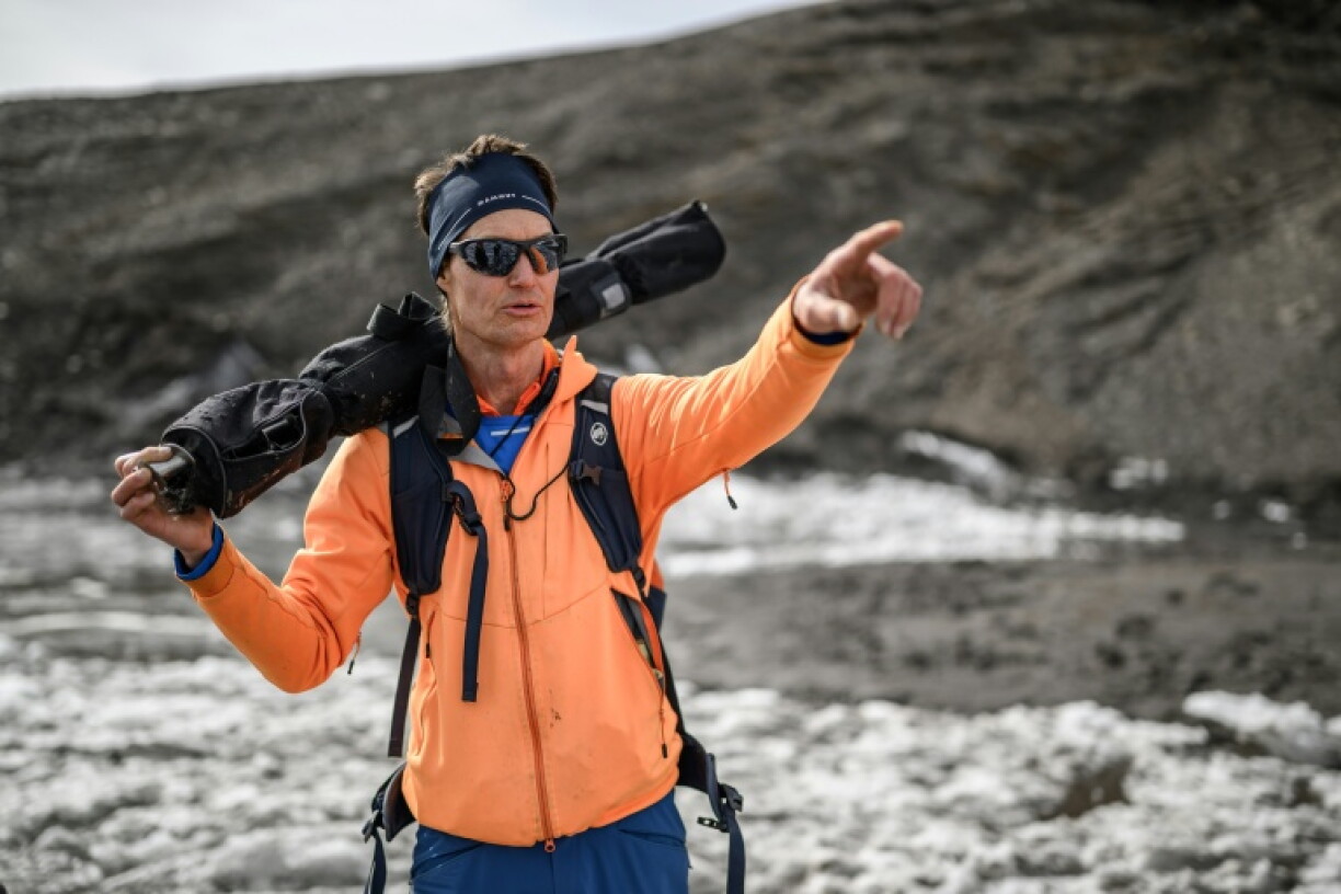 Glaciologist Matthias Huss during a visit to record changes in the melting Scex Rouge glacier in western Switzerland