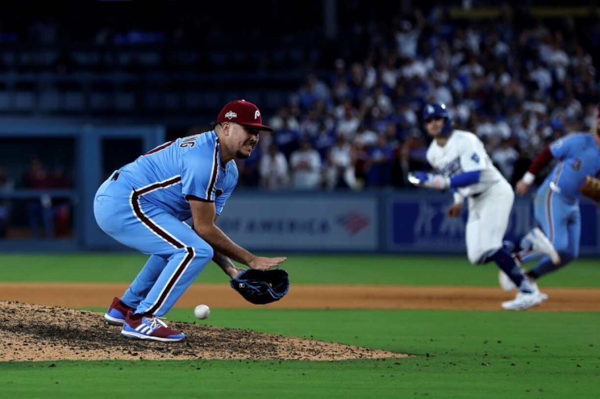 Philadelphia reliever Orion Kerkering misfields a ground ball, allowing the Los Angeles Dodgers to score the winning run in the MLB playoffs