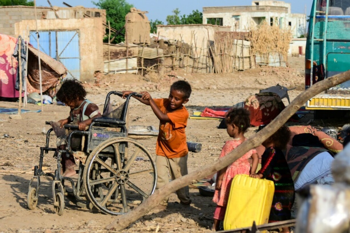 Sudanese children play on a street in Tokar, in Red Sea State, following heavy flooding in October, 2024