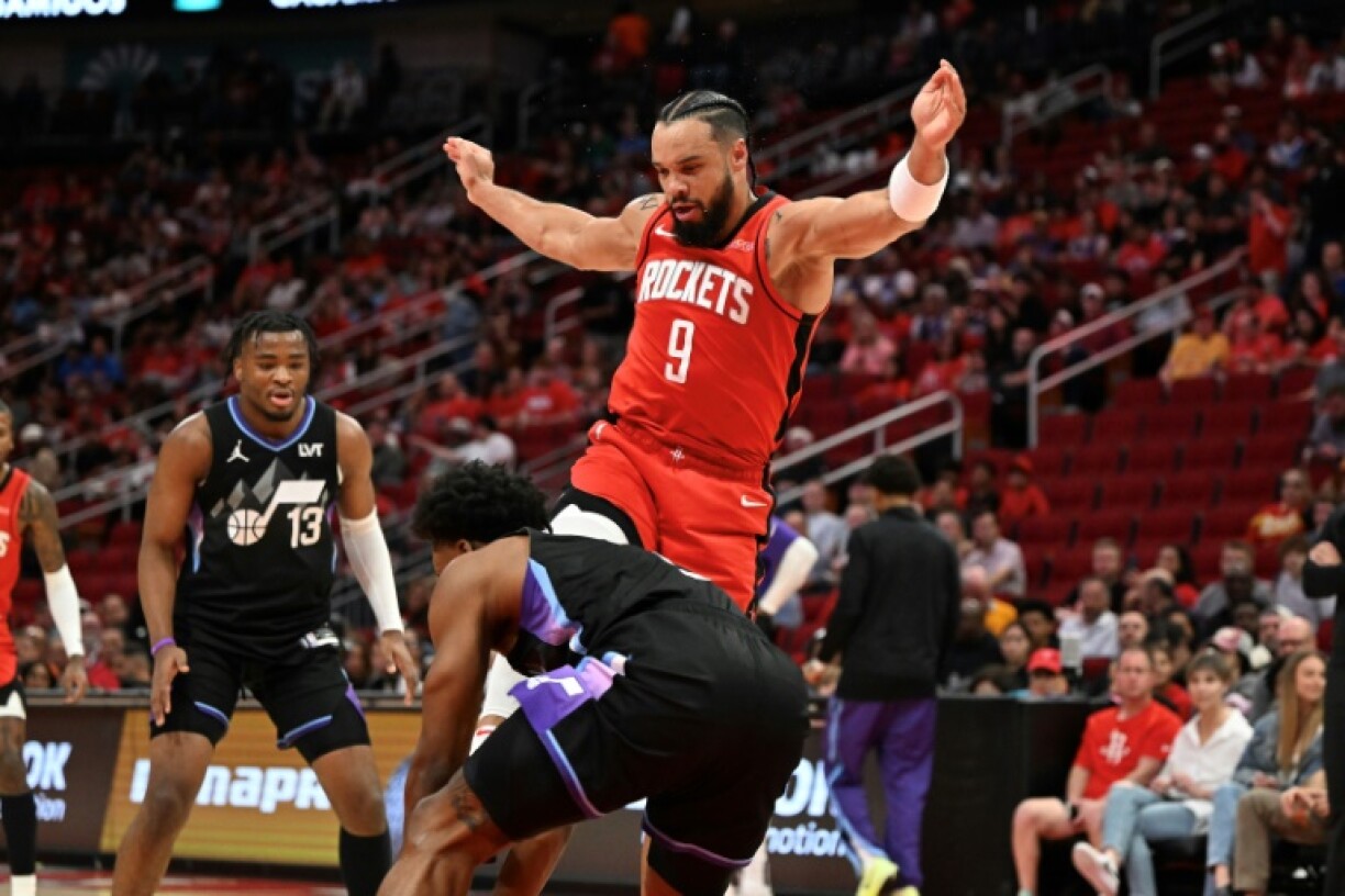 Houston's Dillon Brooks, center top, kicks Utah's Collin Sexton to earn a technical foul that led to a one-game NBA ban for accumulated season technical fouls