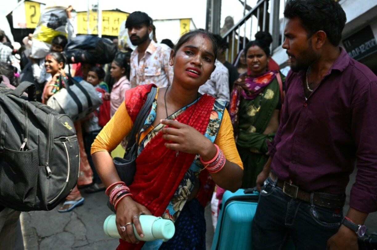 A woman broke down as she tried to board the packed train