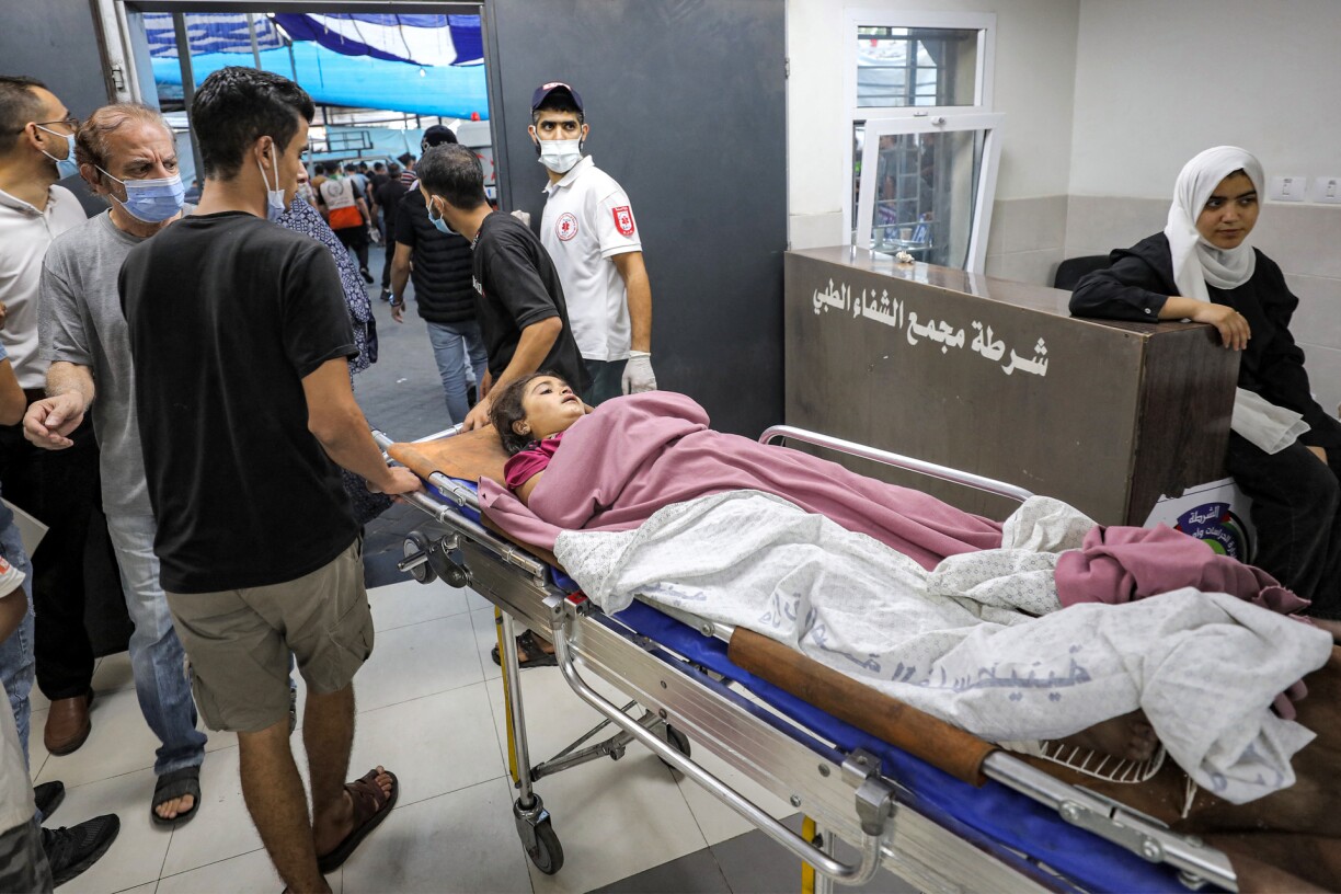 A young victim who was injured in Israeli bombardment is transported on a gurney at Al-Shifa hopsital in Gaza City on November 2, 2023, amid the ongoing battles between Israel and the Palestinian group Hamas.