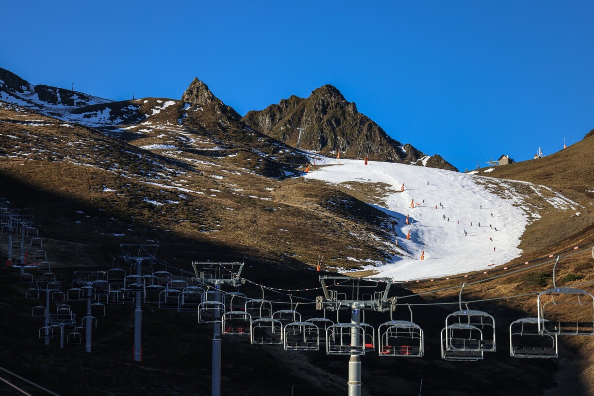 People ski on the remaining snow at the Luchon-Superbagneres ski resort, southwestern France, on January 5, 2023.