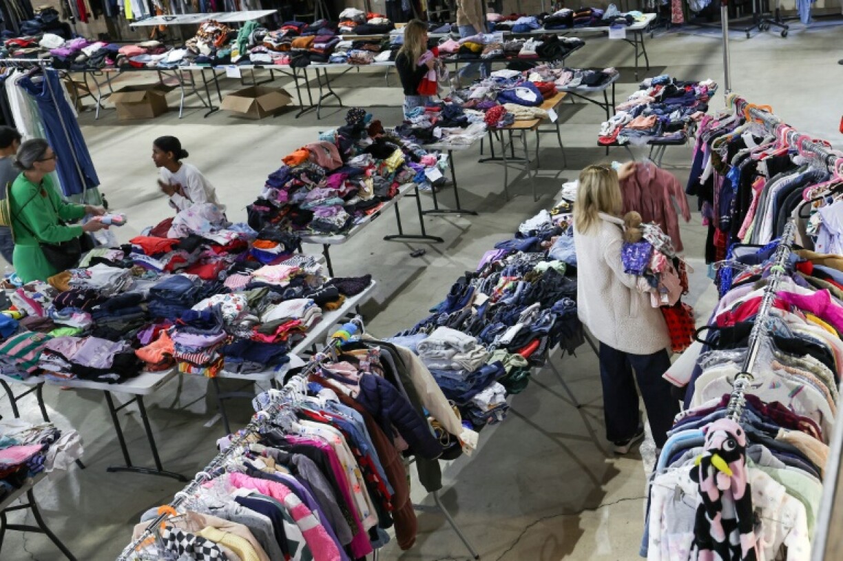 People affected by the Los Angeles fires visit a relief center looking for supplies