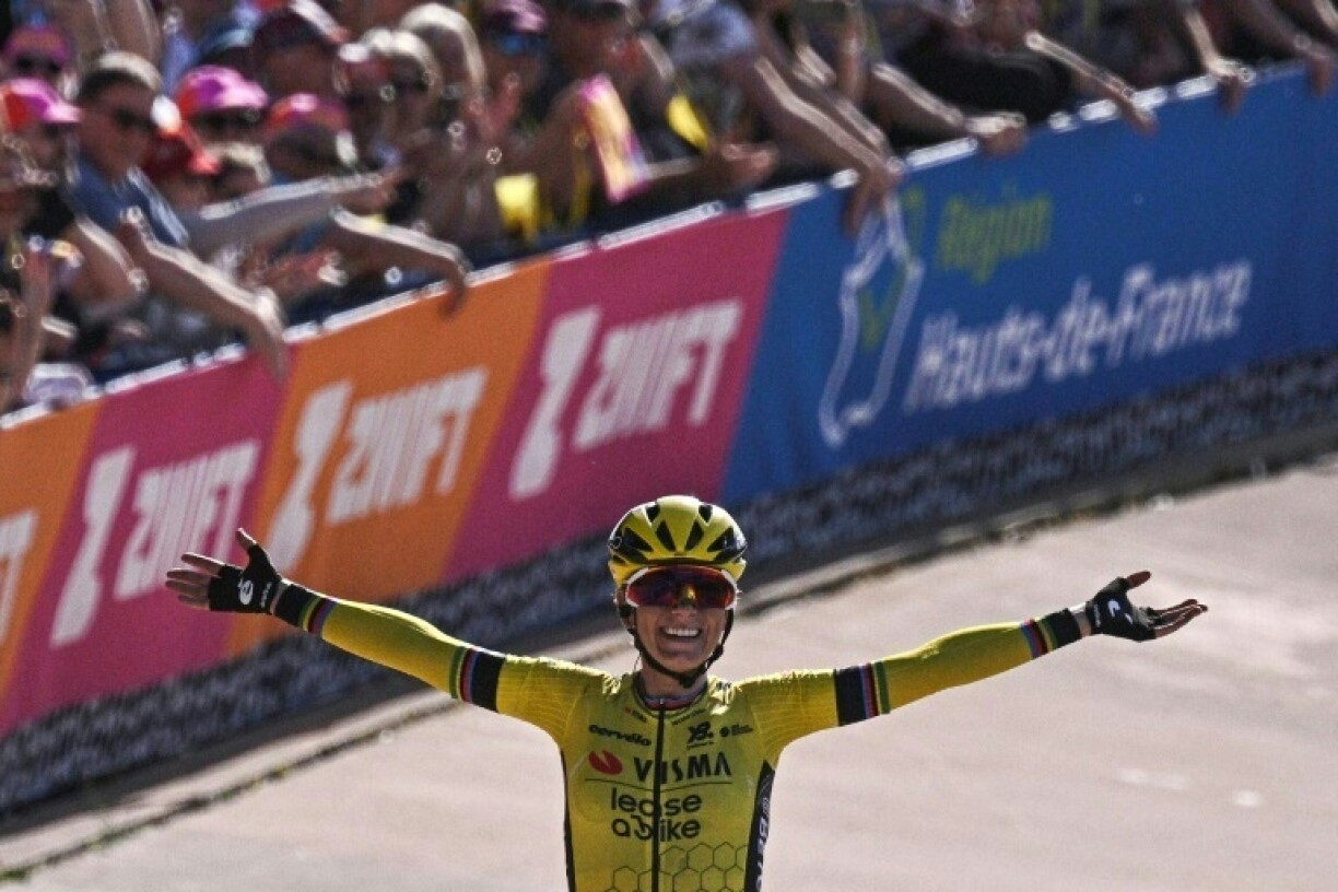Pauline Ferrand-Prevot celebrates as she wins the Paris-Roubaix women's race
