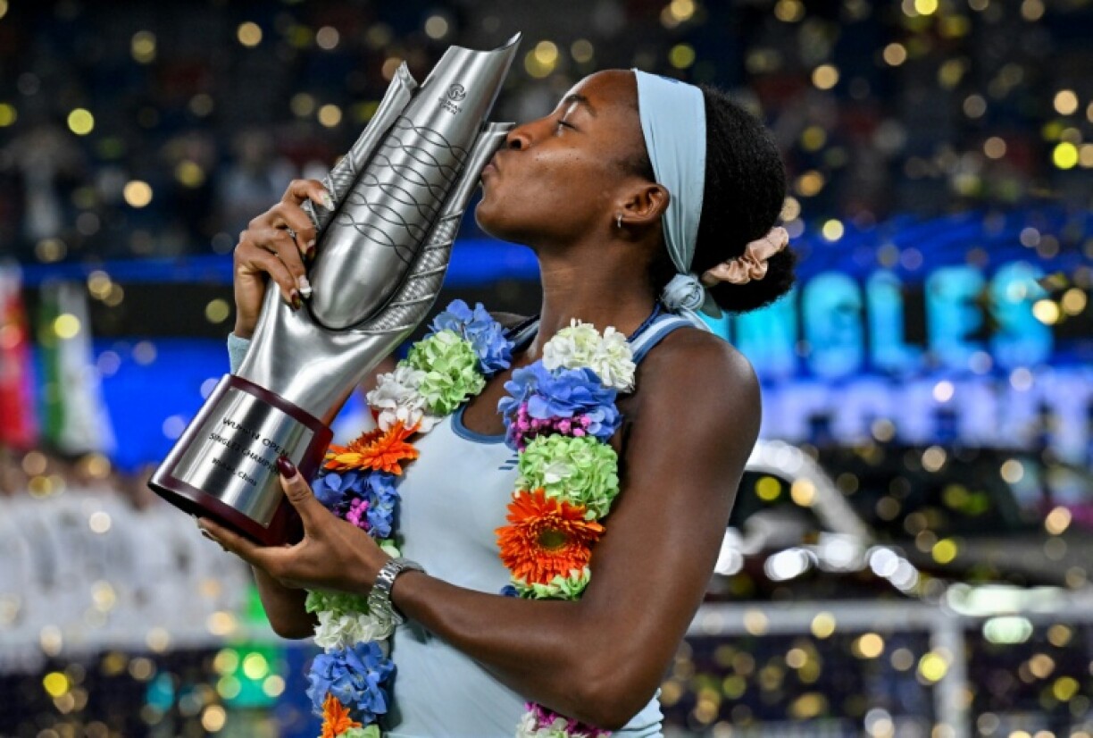 Coco Gauff kisses the trophy after winning the Wuhan Open
