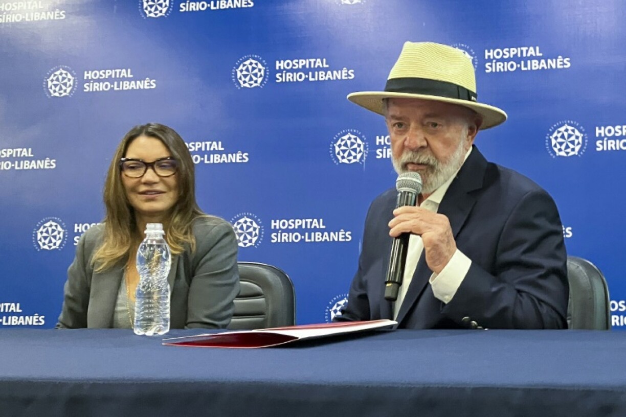 Brazil's President Luiz Inacio Lula da Silva speaks to reporters, accompanied by his wife Rosangela 'Janja' da Silva, after being discharged from Hospital Sirio-Libanes in Sao Paulo