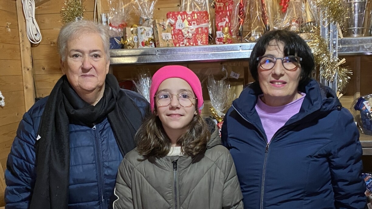 Lara's family pictured at their Dudelange Christmas market stand. Her youngest sister, now 11, never got to meet her.