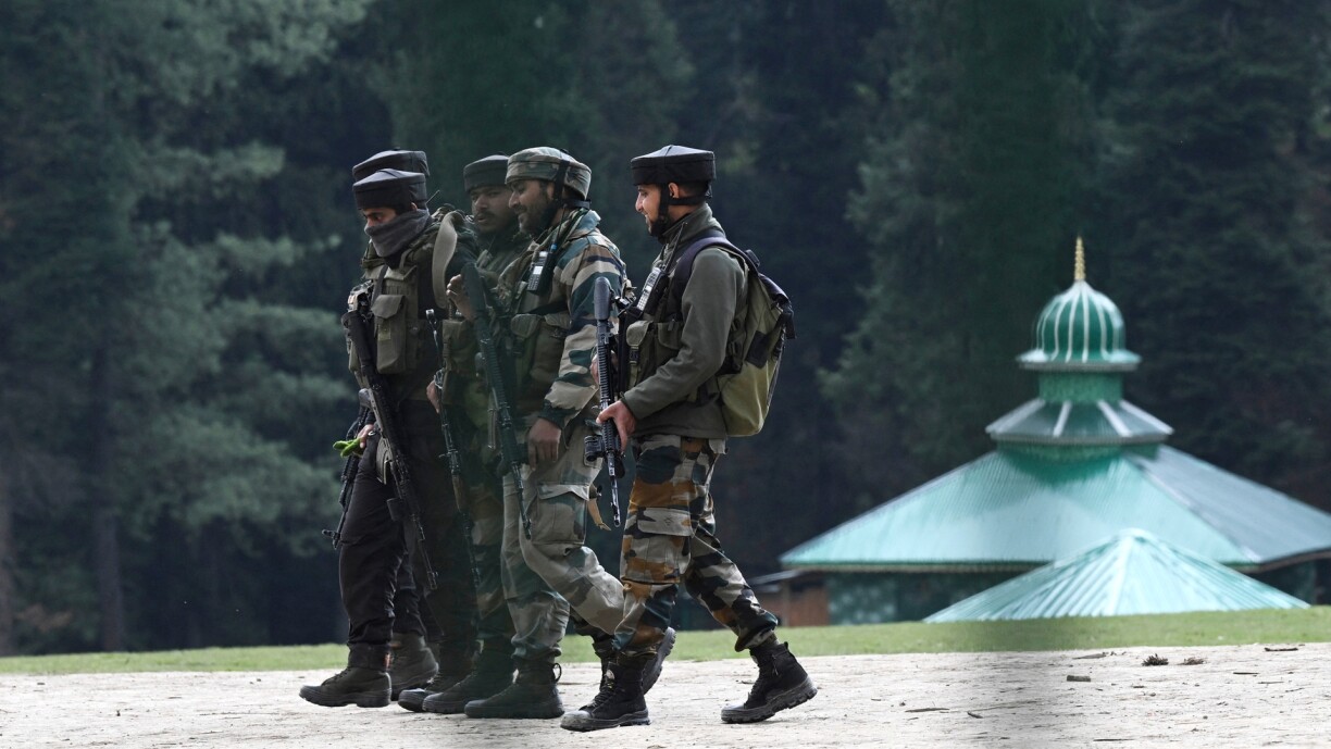 Indian soldiers inspect the site in the aftermath of an attack in Pahalgam, about 90km from Srinagar on 23 April 2025.