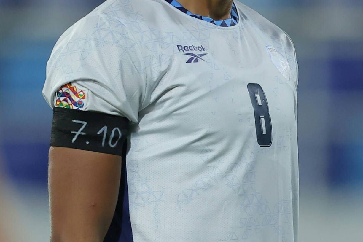 Israel midfielder Dor Peretz wears a black armband with the numbers "7.10" to represent Hamas' October 7, 2023 attack