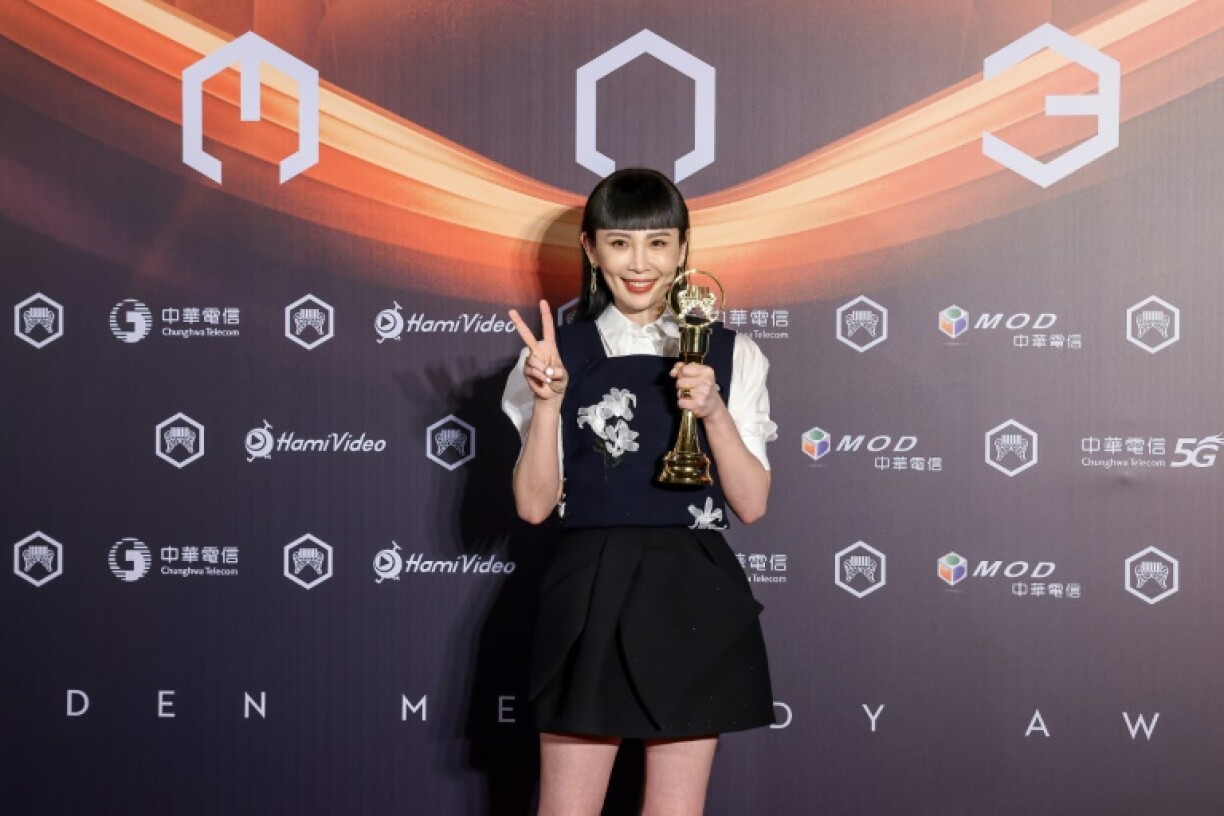Taiwanese singer Waa Wei poses for photographs after winning the Best Female Singer (Mandarin) at the 36th Golden Melody Awards Ceremony at Taipei Arena, in Taipei on June 28, 2025