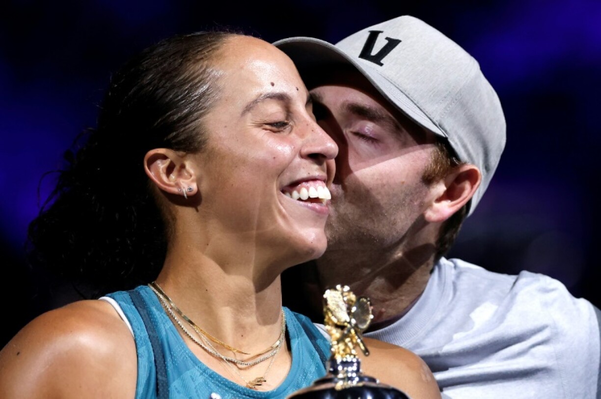 Madison Keys gets a kiss from her husband and coach, Bjorn Fratangelo, after winning the Australian Open