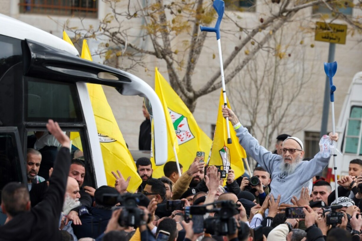 A jubilant crowd greeted a busload of freed Palestinian prisoners in Ramallah on Saturday