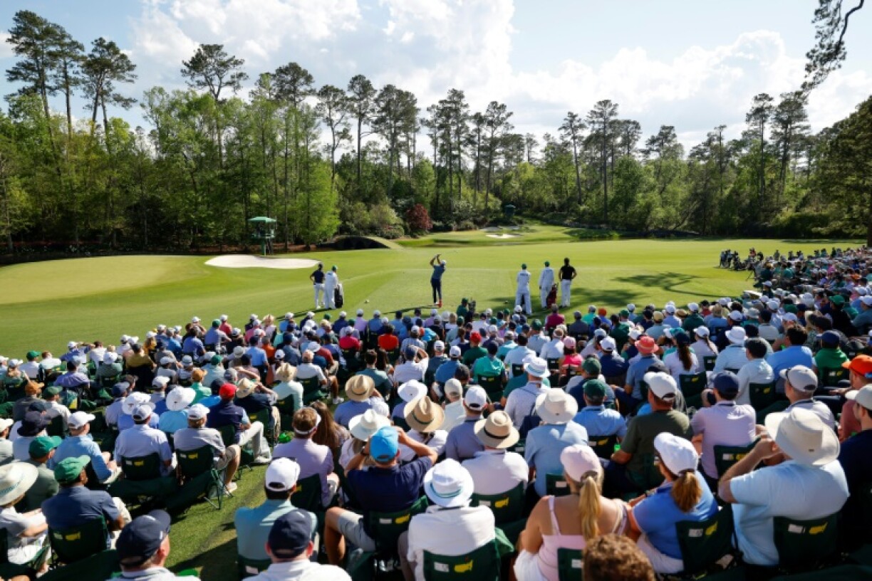 Defending champion Scottie Scheffler plays the 12th hole of Augusta National in the second round of the Masters