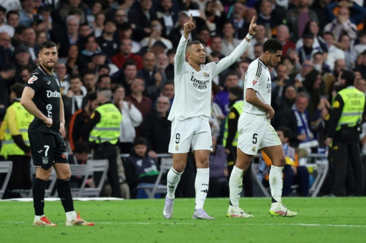 Real Madrid's French forward Kylian Mbappe (C) celebrates scoring his second goal against Leganes