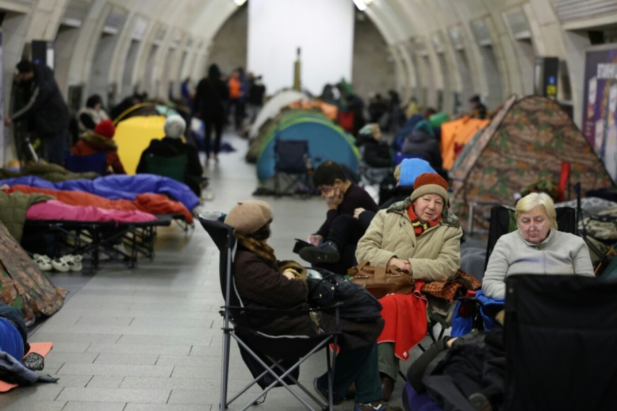 People take shelter at a metro station during Russian air attacks in Kyiv