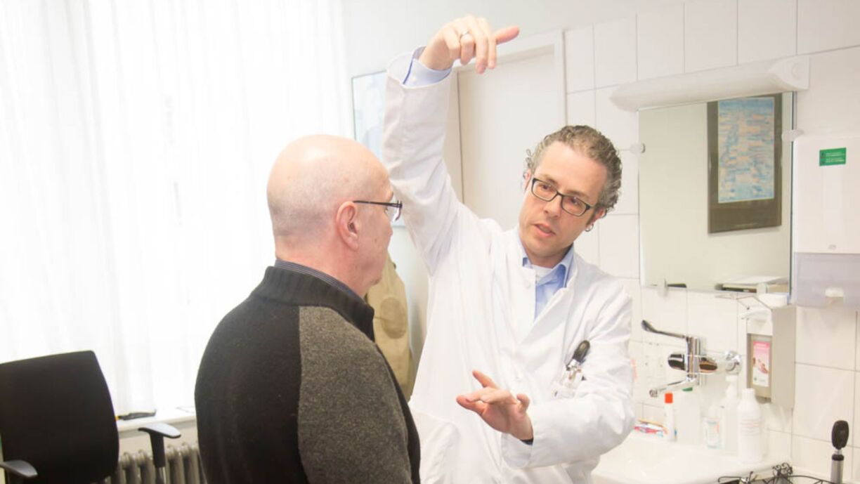 Prof. Krüger works with a patient