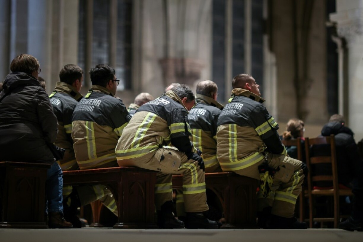 Firefighters were among those who attended a memorial service a day after the attack