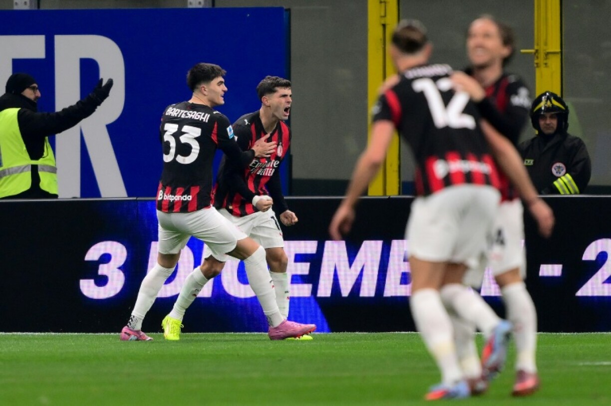 Christian Pulisic (C) celebrates scoring AC Milan's winner against Inter Milan on Sunday