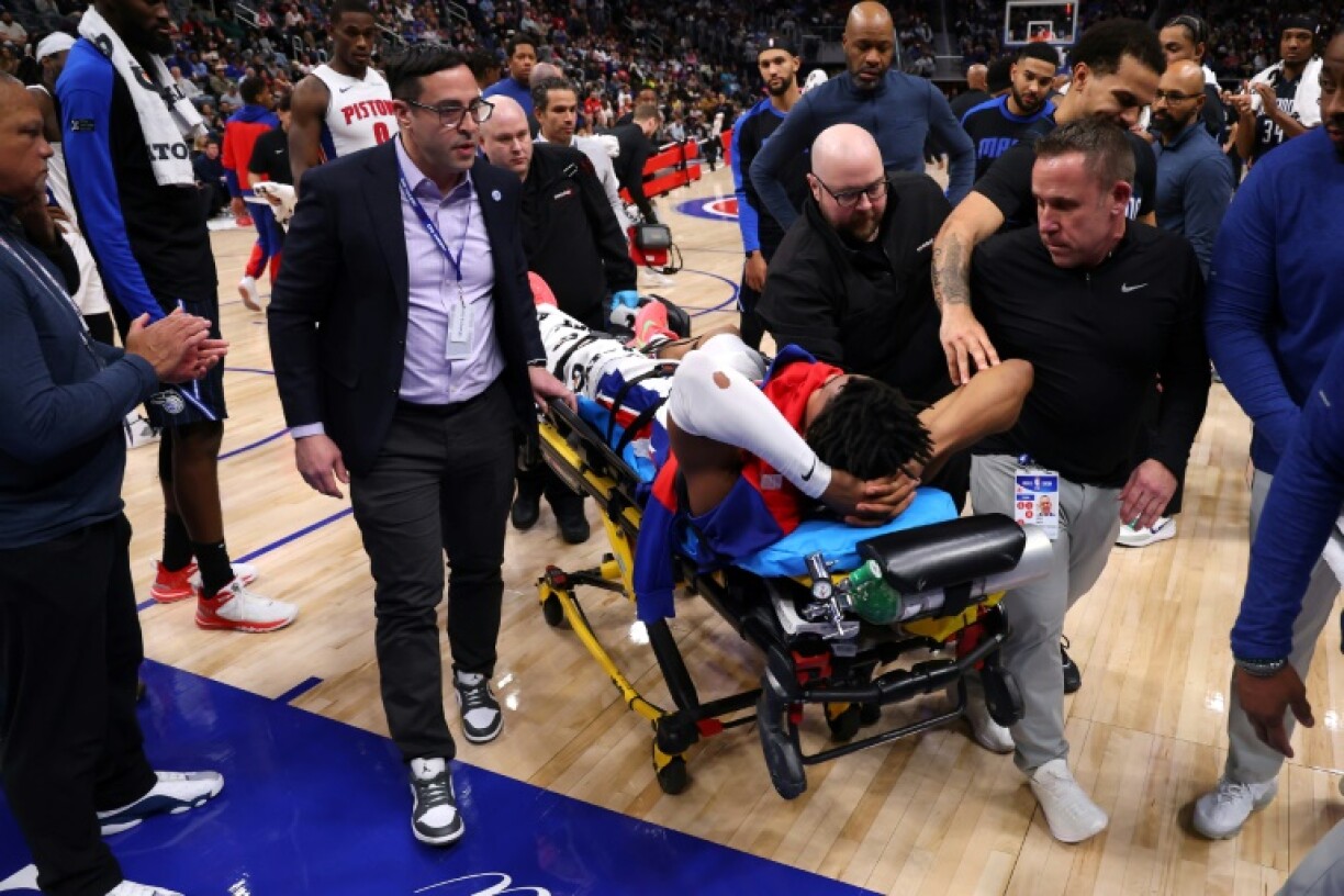 Jaden Ivey of the Detroit Pistons is stretchered off the court after suffering a leg injury late in the Pistons' NBA victory over the Orlando Magic
