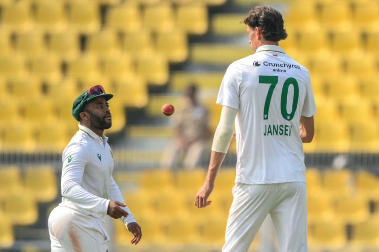 South Africa's captain Temba Bavuma (left) speaks with pace bowler Marco Jansen