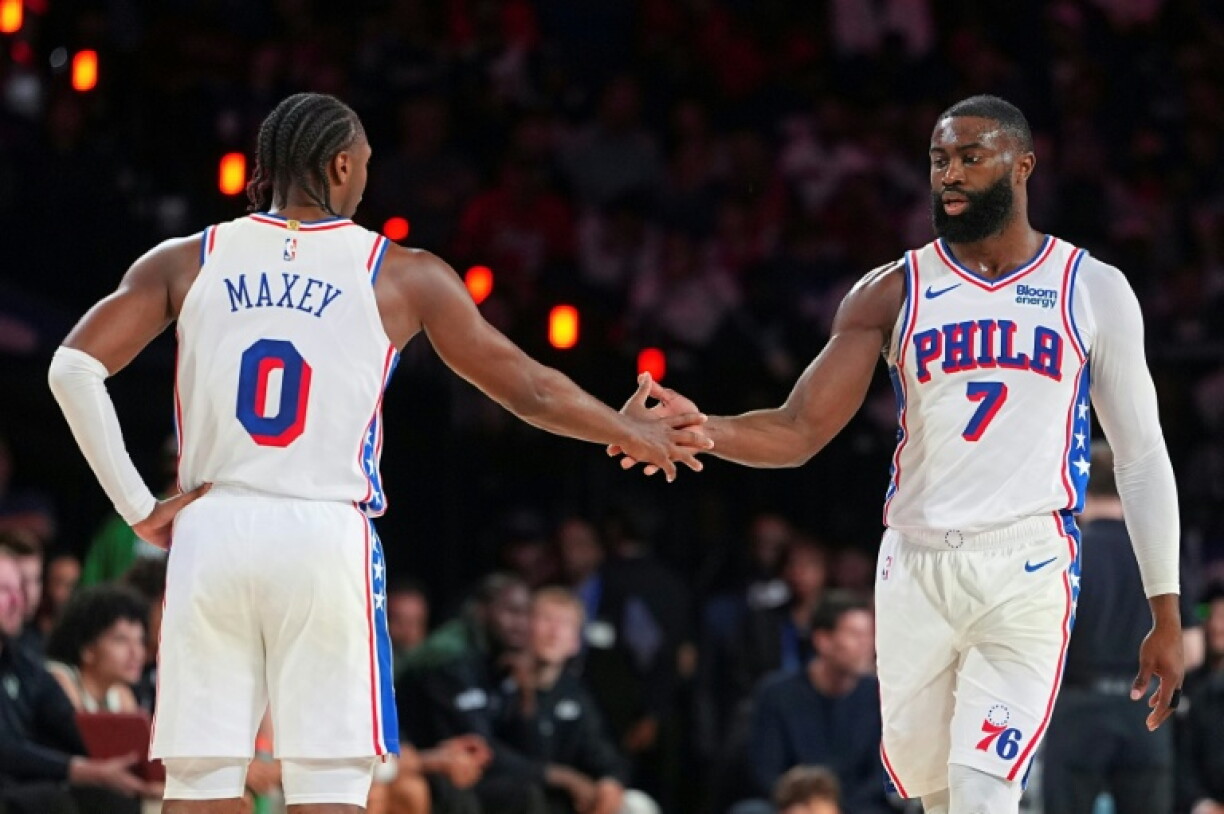 Tyrese Maxey celebrates with Philadelphia 76ers team-mate Jaylen Brown in their win over Milwaukee