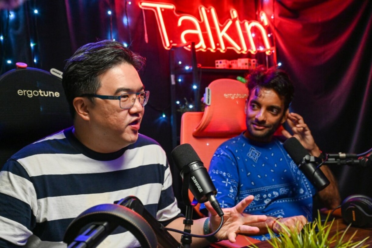 Terence Chia (L) and Haresh Tilani (R) interview Singaporean opposition politicians for their podcast