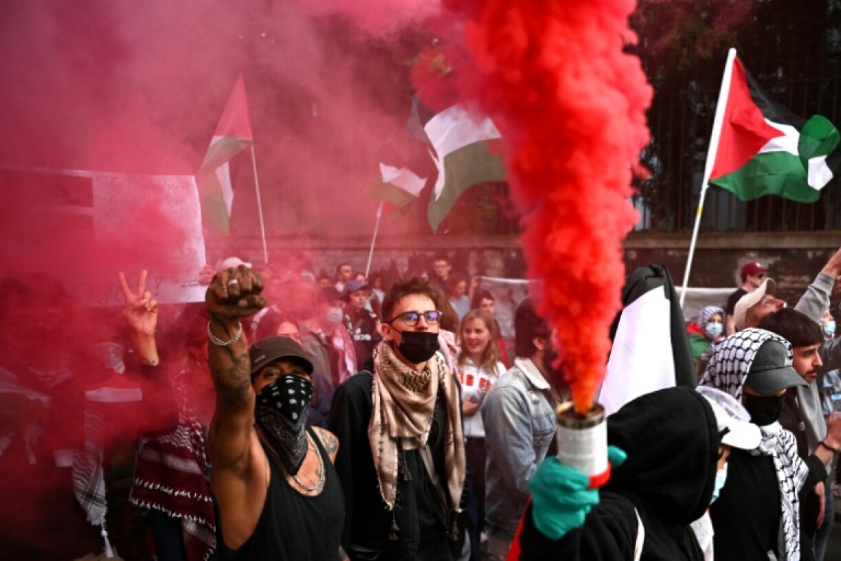 Protesters let off smoke bombs during the demonstration