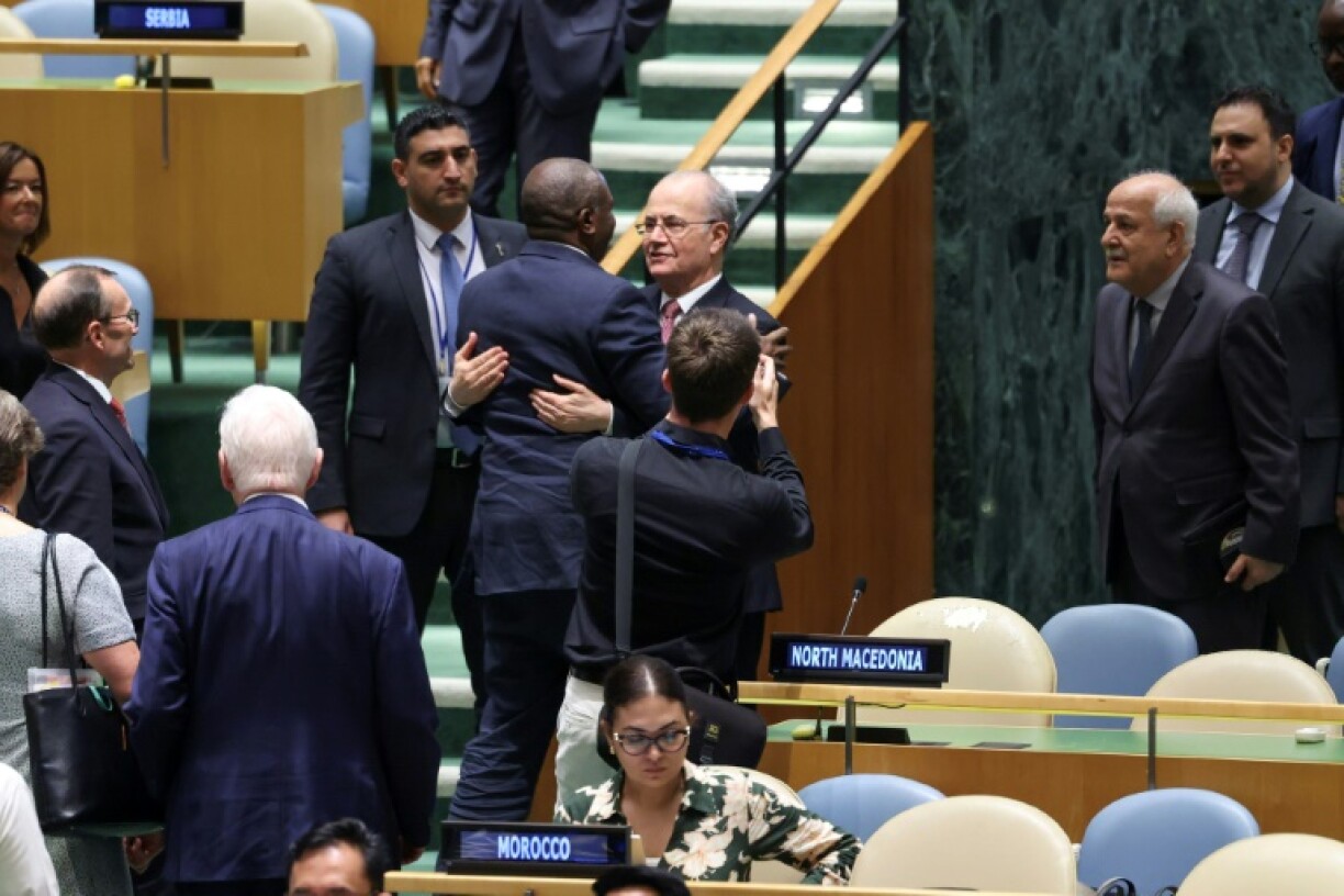 British Foreign Secretary David Lammy embraces Palestinian Prime Minister Mohammad Mustafa