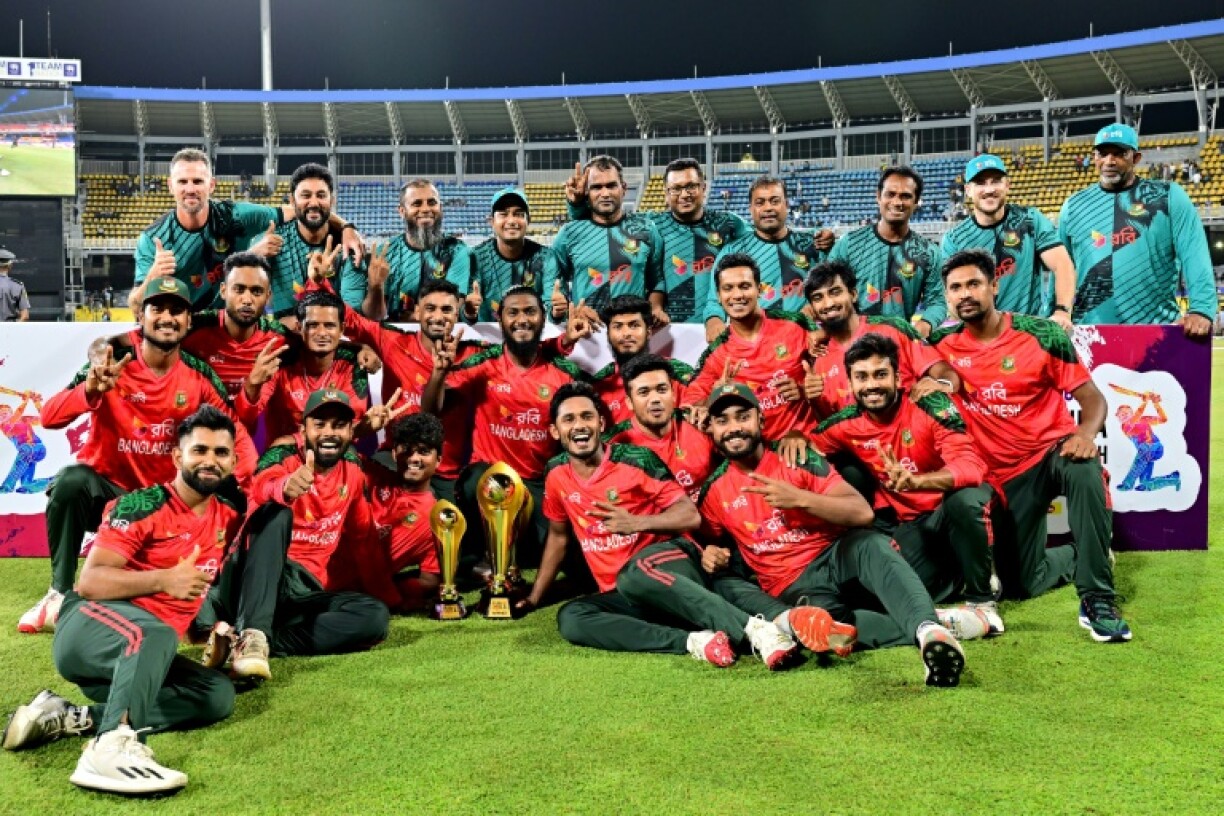 Bangladesh players pose with the trophy after winning the Third and final Twenty20 international against Sri Lanka