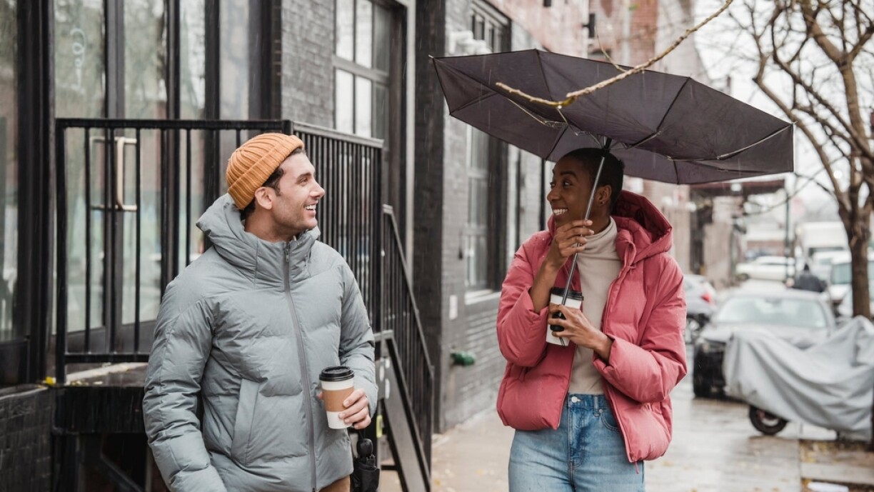 Needless to sat, this is a stock photo, and these people are actors. No one would react with such a sunny smile upon finding their umbrella broken by wind.