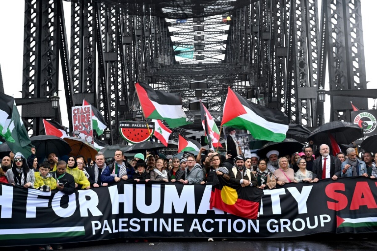 Demonstrators march across the Sydney Harbour Bridge during a pro-Palestinian on August 3, 2025