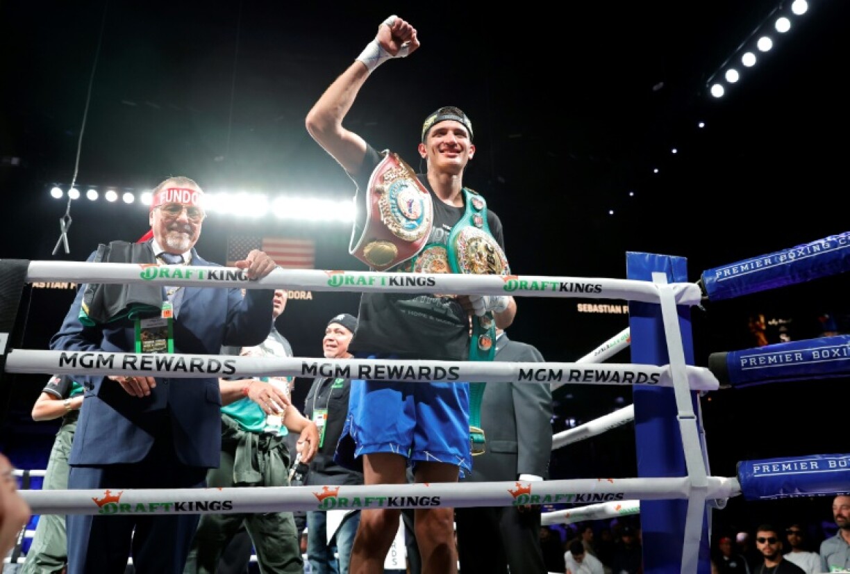 Sebastian Fundora celebrates after stoppinig Chordale Booker in the fourth round to retain his WBC and WBO super welterweight world titles in Las Vegas