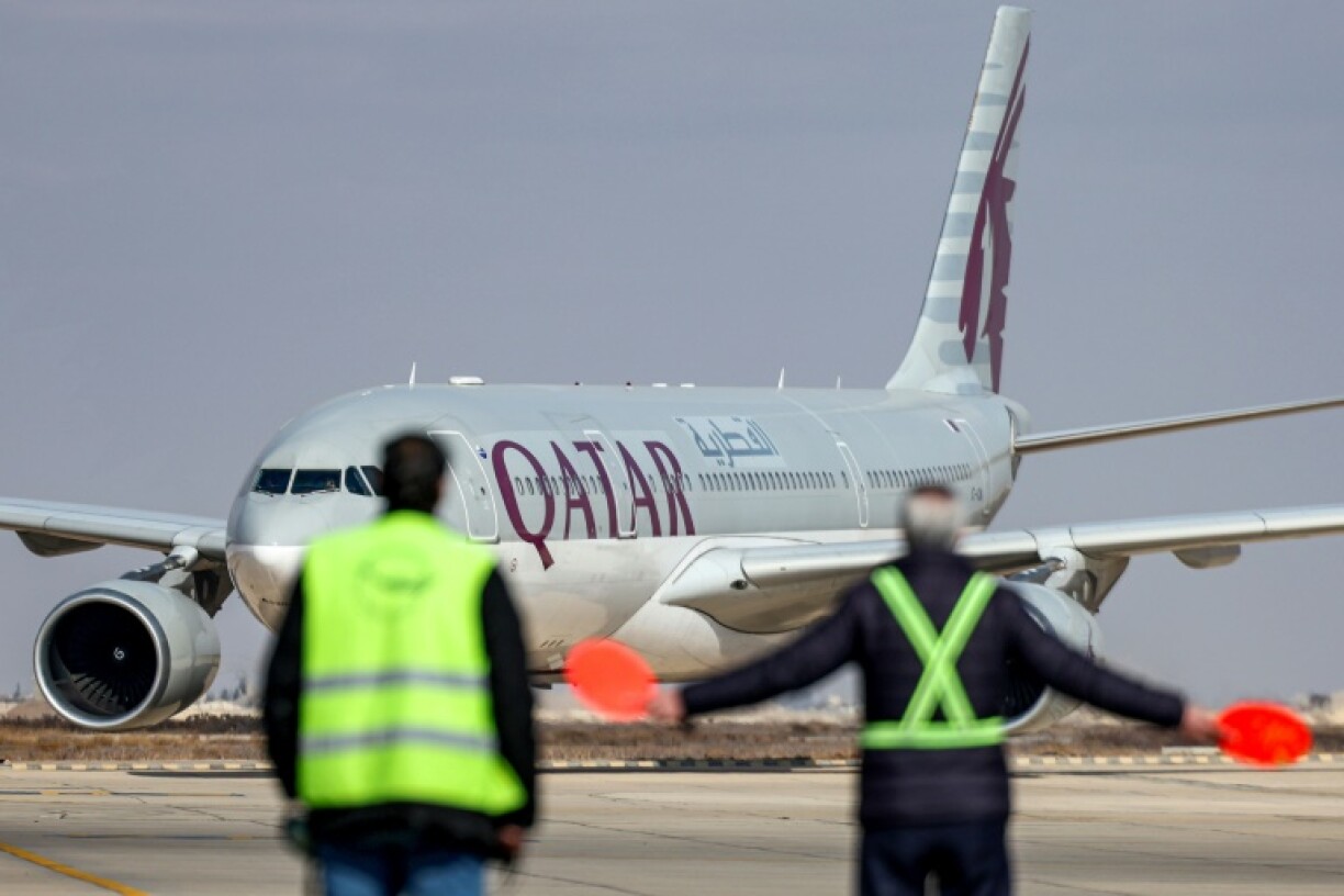 An Australian couple have criticised Qatar Airways after a blanket-draped corpse was seated next to them during a long-haul flight