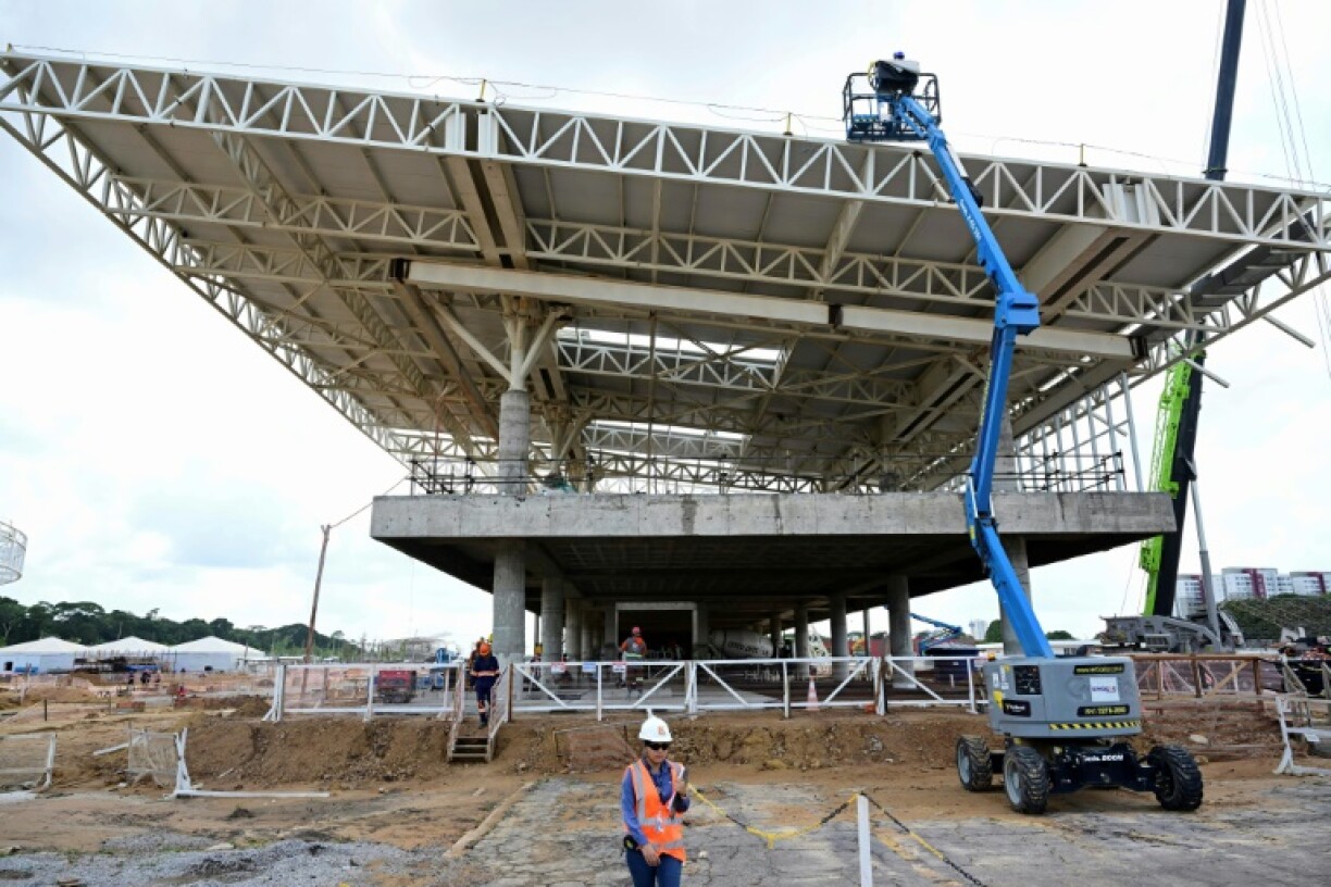 Employees work at the construction site of the City Park, the main venue of COP30 in Belemecember 3, 2024. With 200 workers laboring seven days a week, the largest open-air market in Latin America reflects the transformation currently underway in the Brazilian city, which is preparing to host COP30 in November -- the first UN climate conference in the Amazon.