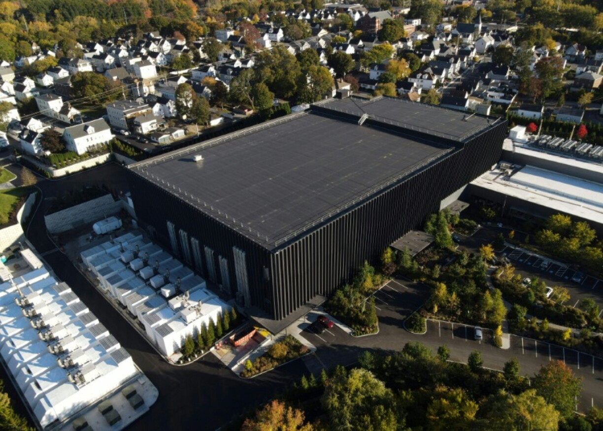 This aerial photo shows the Markley Lowell Data Center surrounded by residential neighborhood homes and apartment buildings in Lowell, Massachusetts