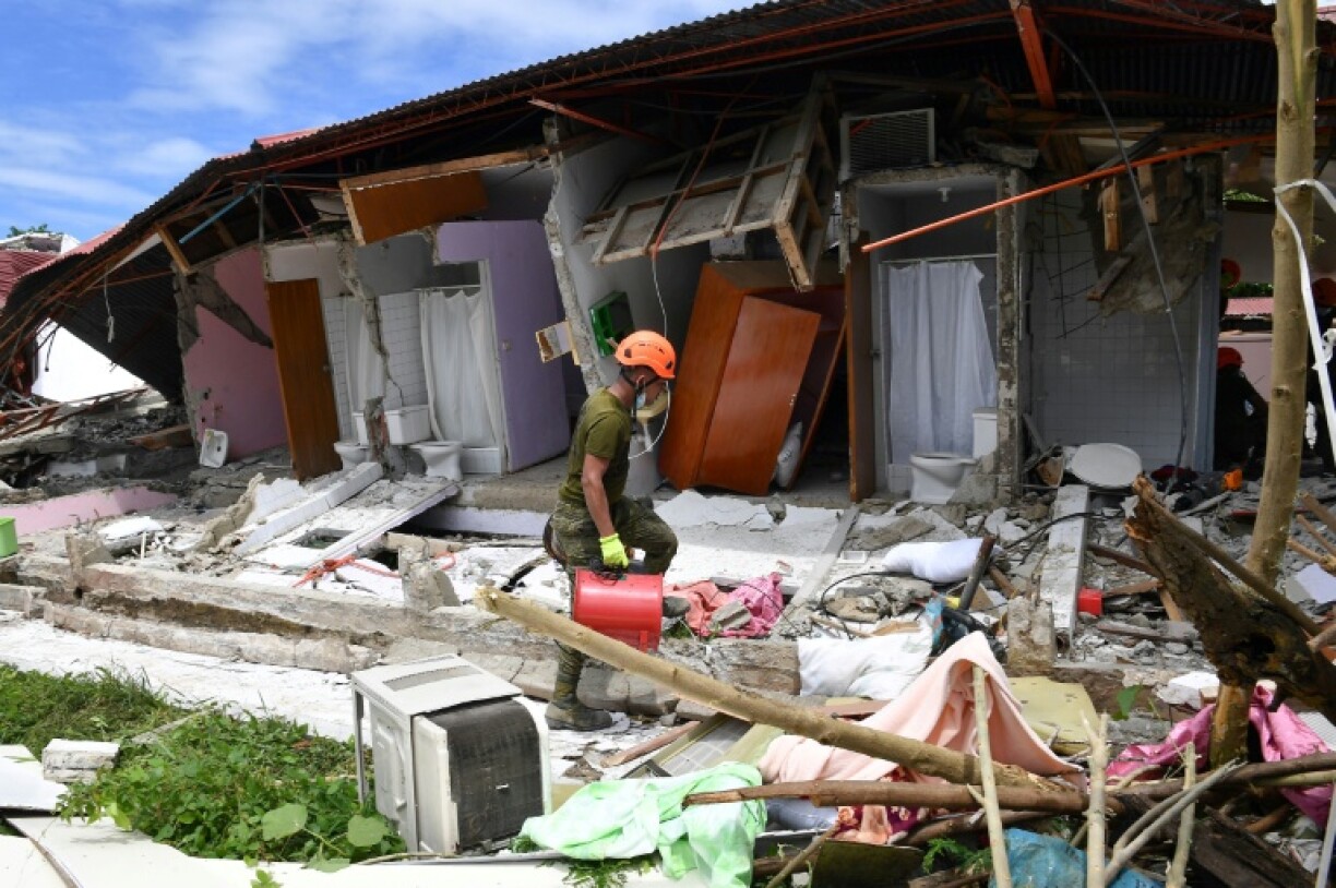 Buildings collapsed in Bogo city and other nearby municipalities after a powerful earthquake struck the central Philippines, killing at least 69 people