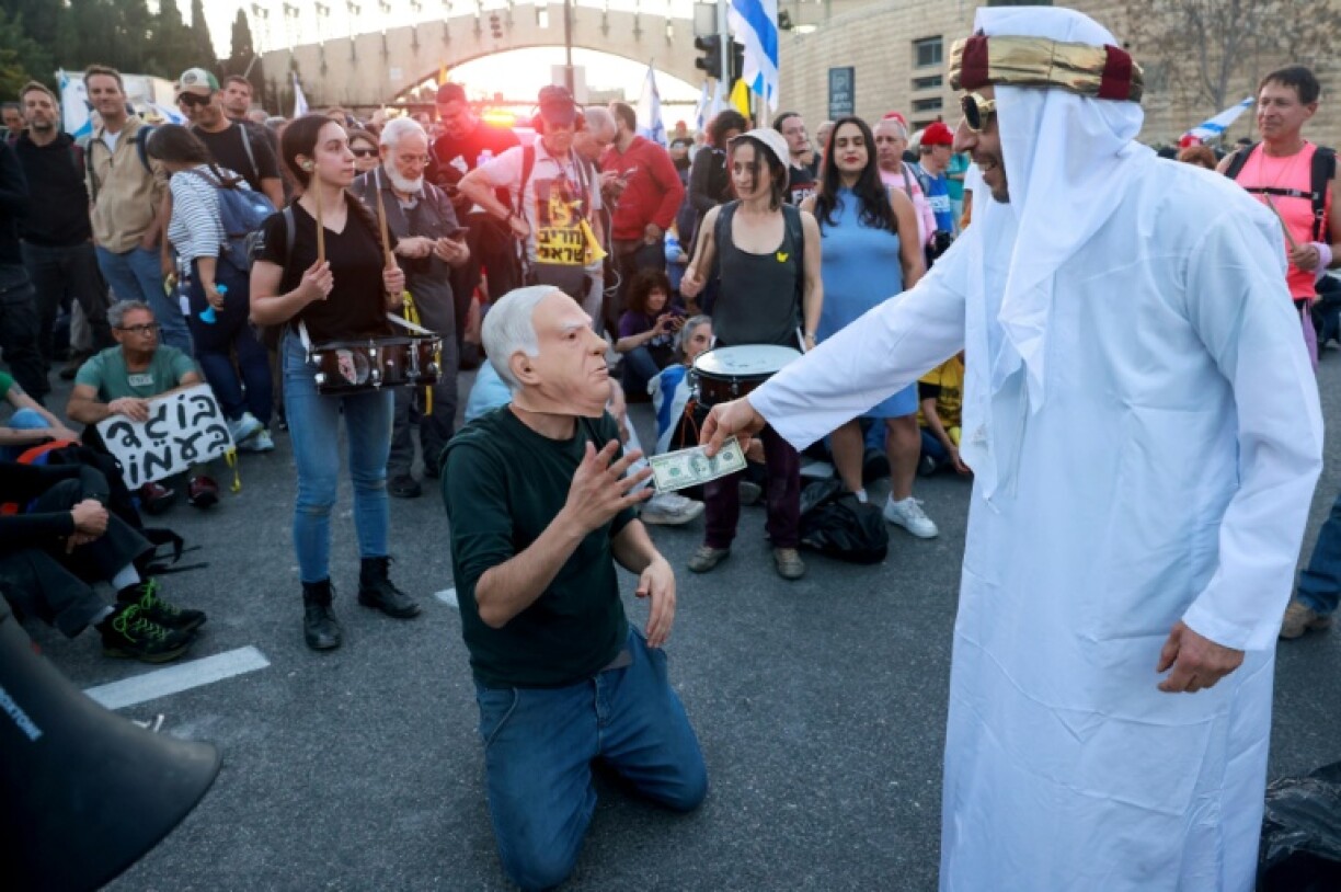 Israeli anti-government demonstrators outside parliament in Jerusalem mock Prime Minister Benjamin Netanyahu over what local media have dubbed