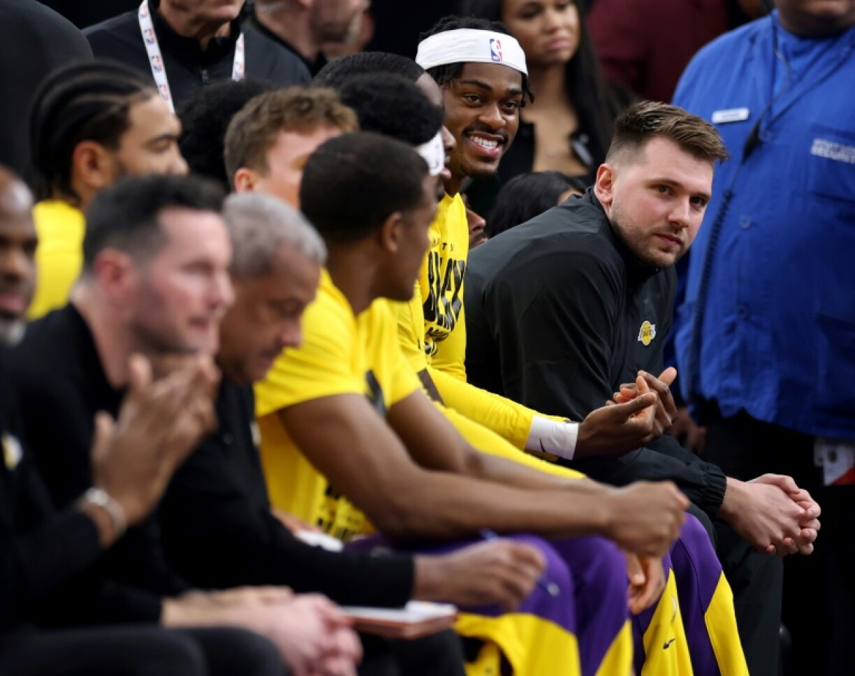 Luka Doncic (right) watches his new Los Angeles Lakers team-mates demolish the Los Angeles Clippers