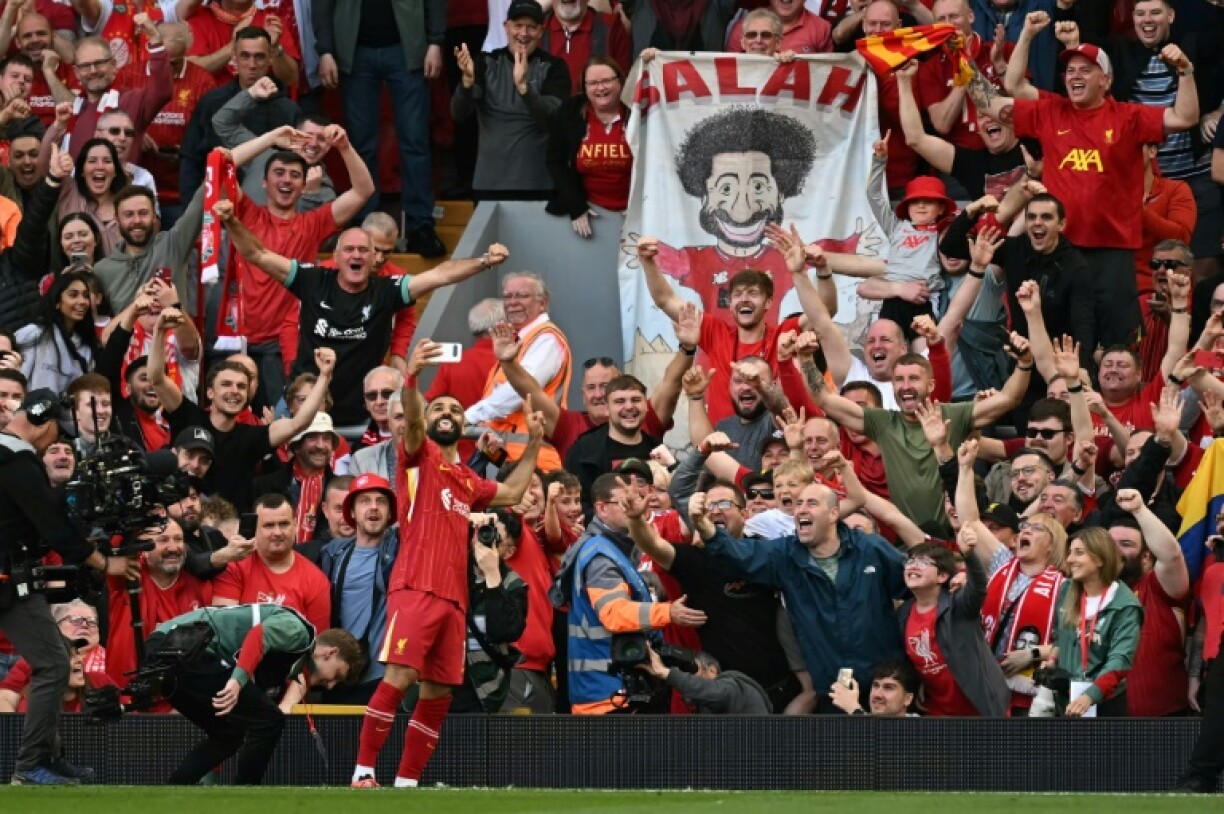Liverpool striker Mohamed Salah takes a selfie with the fans after scoring against Tottenham on Sunday