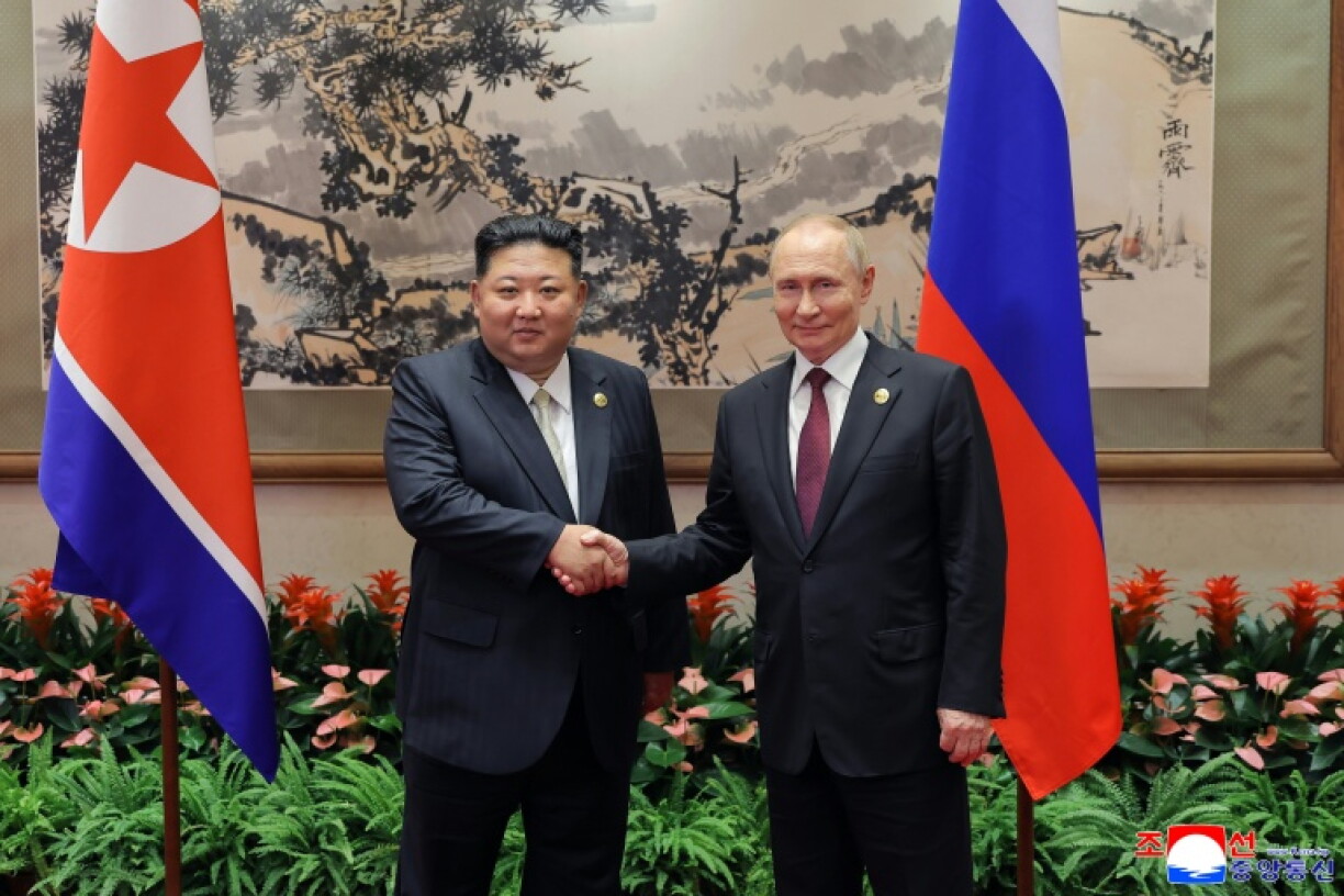 North Korean leader Kim Jong Un (L) meeting Russia's President Vladimir Putin in Beijing, after attending a military parade marking the 80th anniversary of victory over Japan and the end of World War II on September 3, 2025