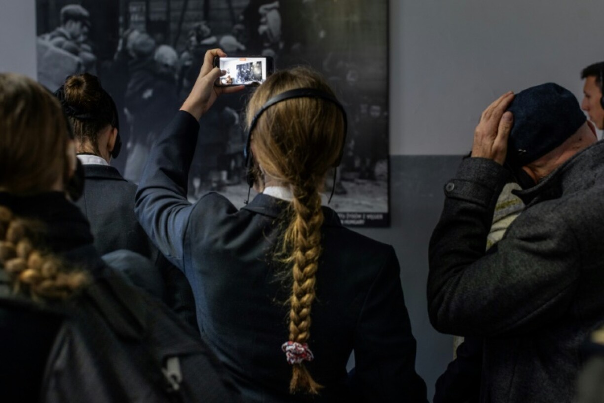 High school students visiting the museum at the Auschwitz-Birkenau death camp