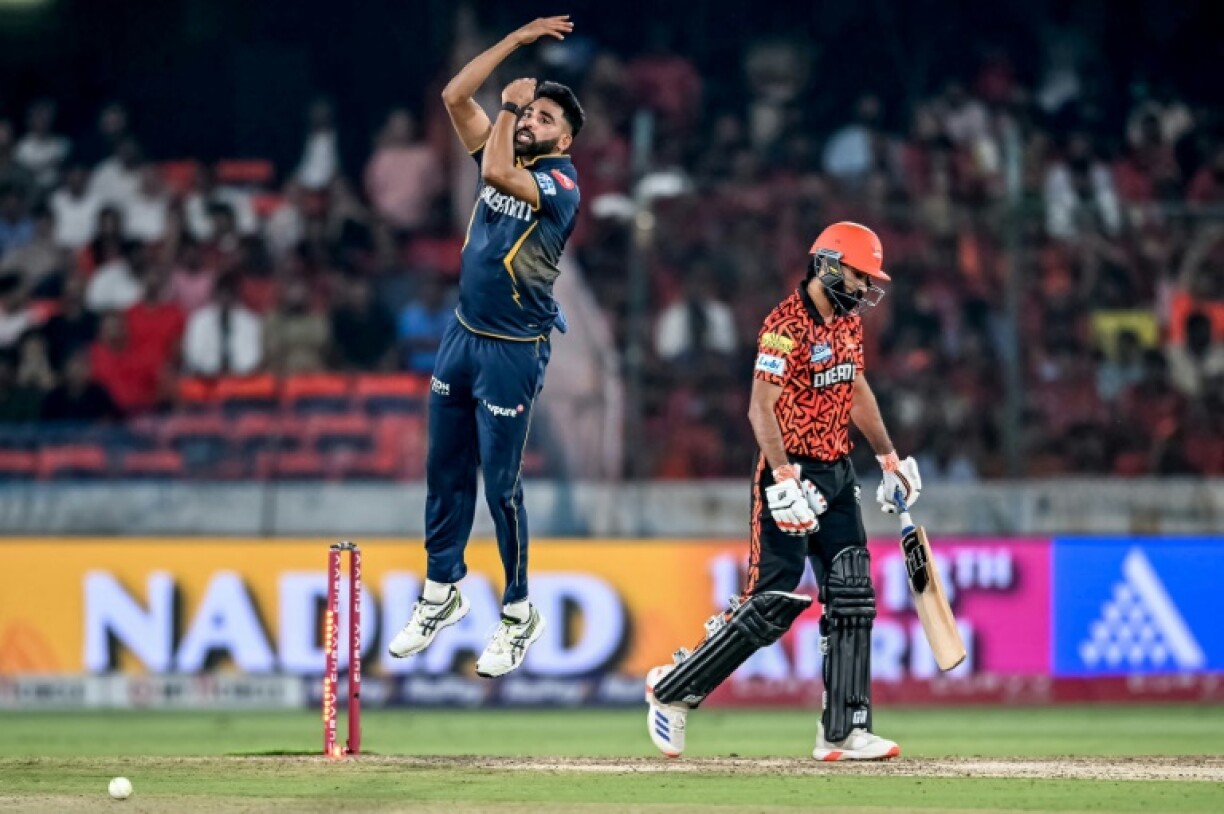 Gujarat Titans' Mohammed Siraj takes the wicket of Sunrisers Hyderabad's Simarjeet Singh