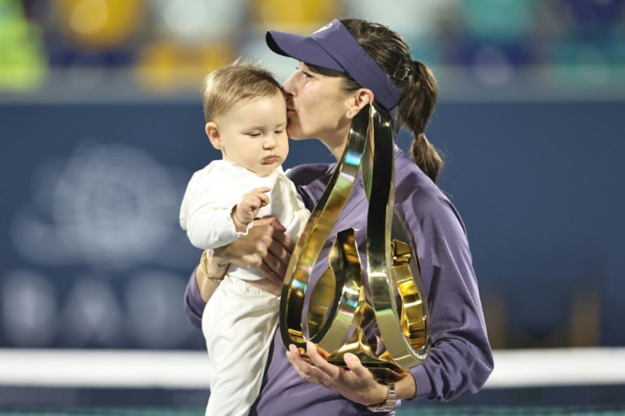 'So blessed': Belinda Bencic celebrates with her daughter after defeating Ashlyn Krueger to win the Abu Dhabi title