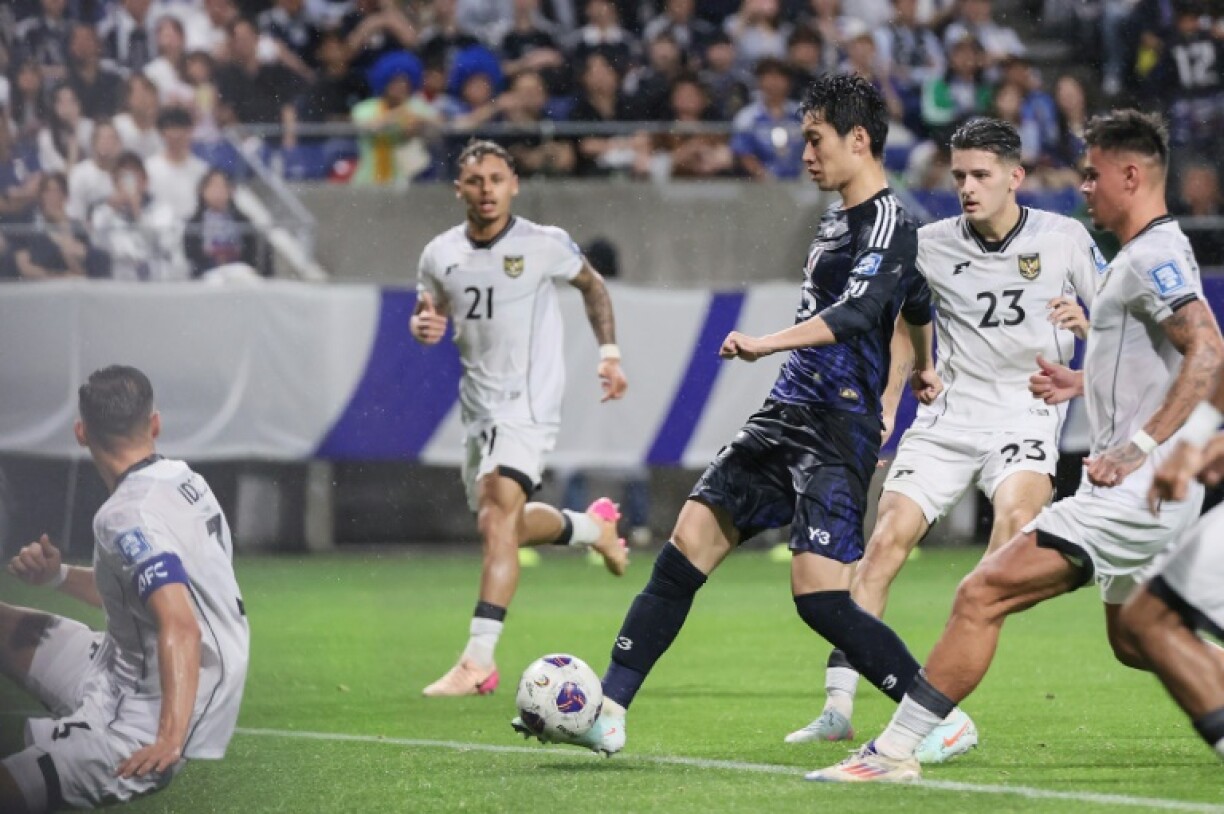 Daichi Kamada shoots in Japan's game against Indonesia