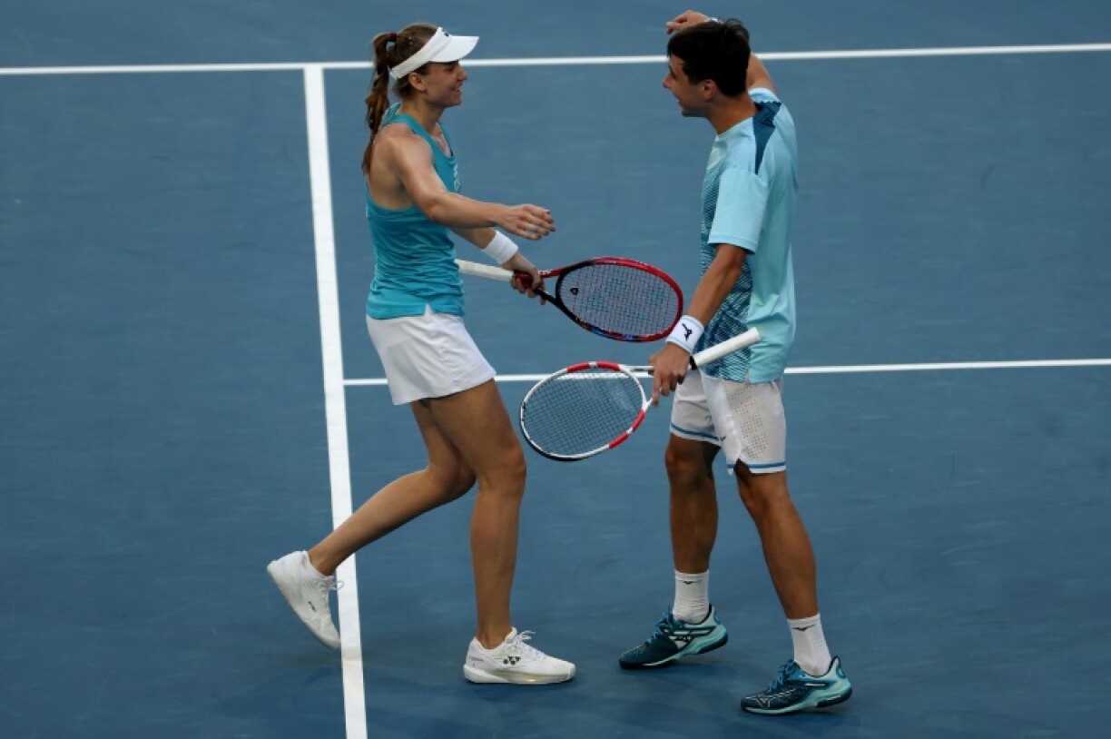 Kazakhstan's Elena Rybakina (L) and teammate Alexander Shevchenko celebrate their win at the United Cup