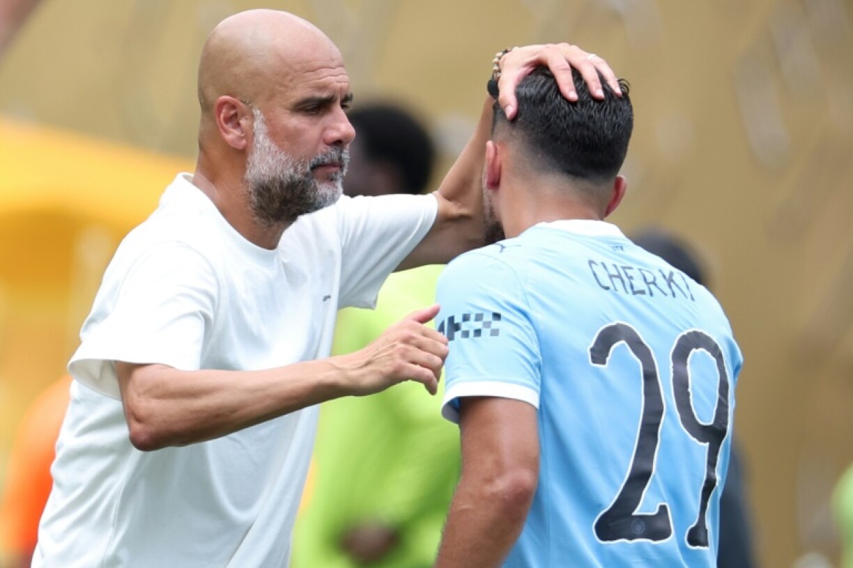 Manchester City coach Pep Guardiola congratulates Rayan Cherki as the Frenchman comes off during the second half of the Club World Cup win over Wydad Casablanca on Wednesday