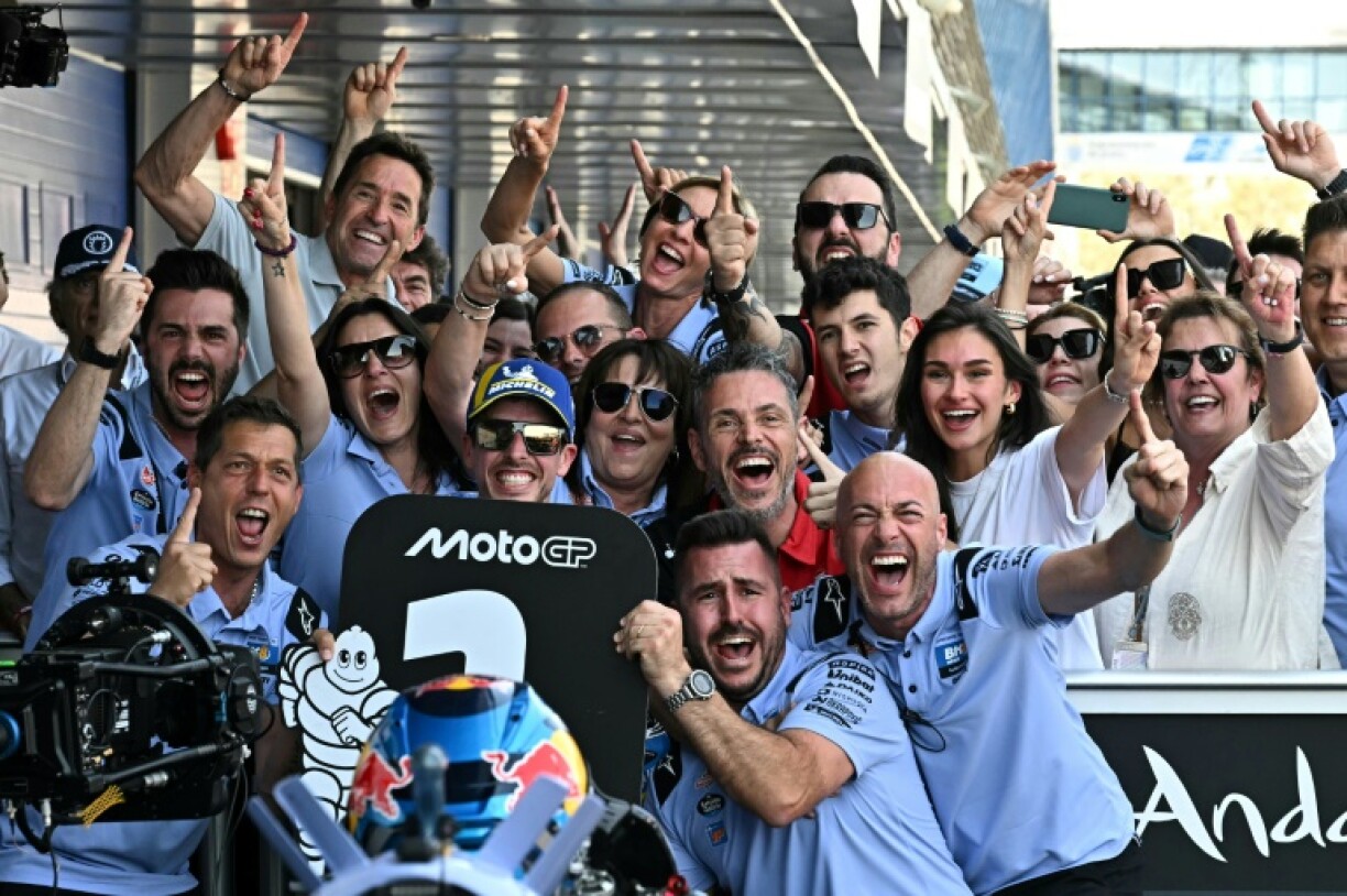 Alex Marquez (C) celebrates his maiden MotoGP victory in the Spanish Grand Prix with his Ducati-Gresini team