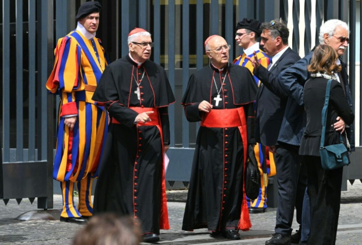 Peruvian cardinals Carlos Castillo Mattasoglio (2nd L) and Pedro Barreto (C) leave the Vatican on April 24